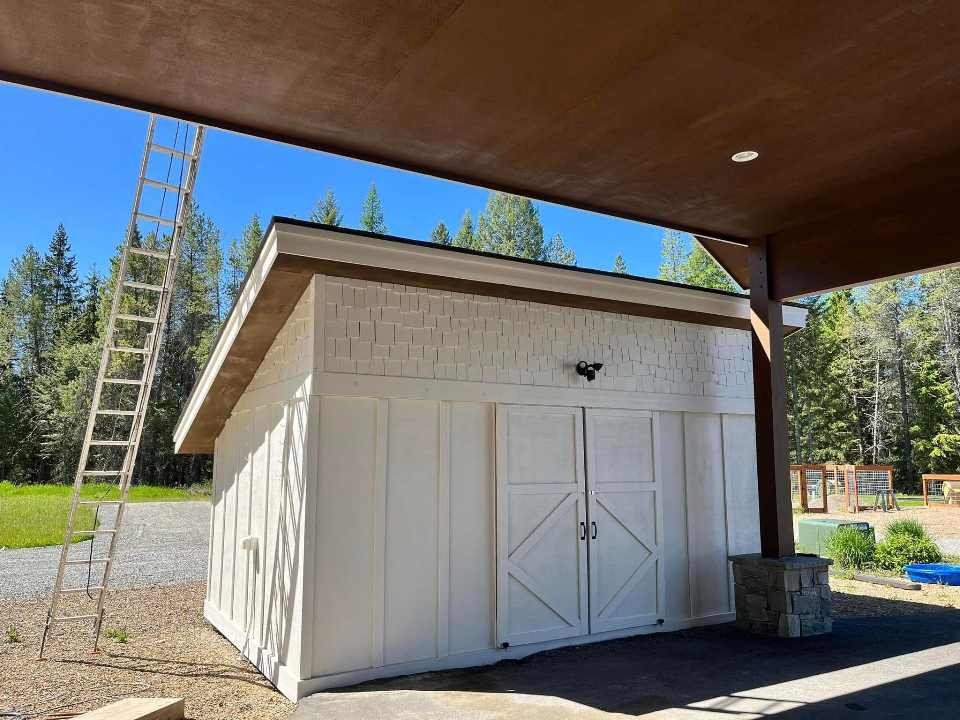 Custom shed exterior painted by Treeline Painting in Western Montana