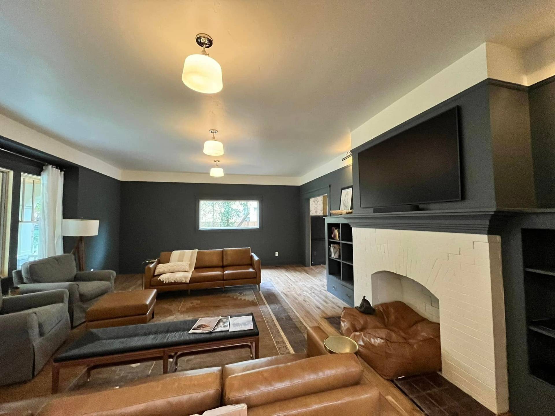 Living room with dark charcoal walls and white ceiling