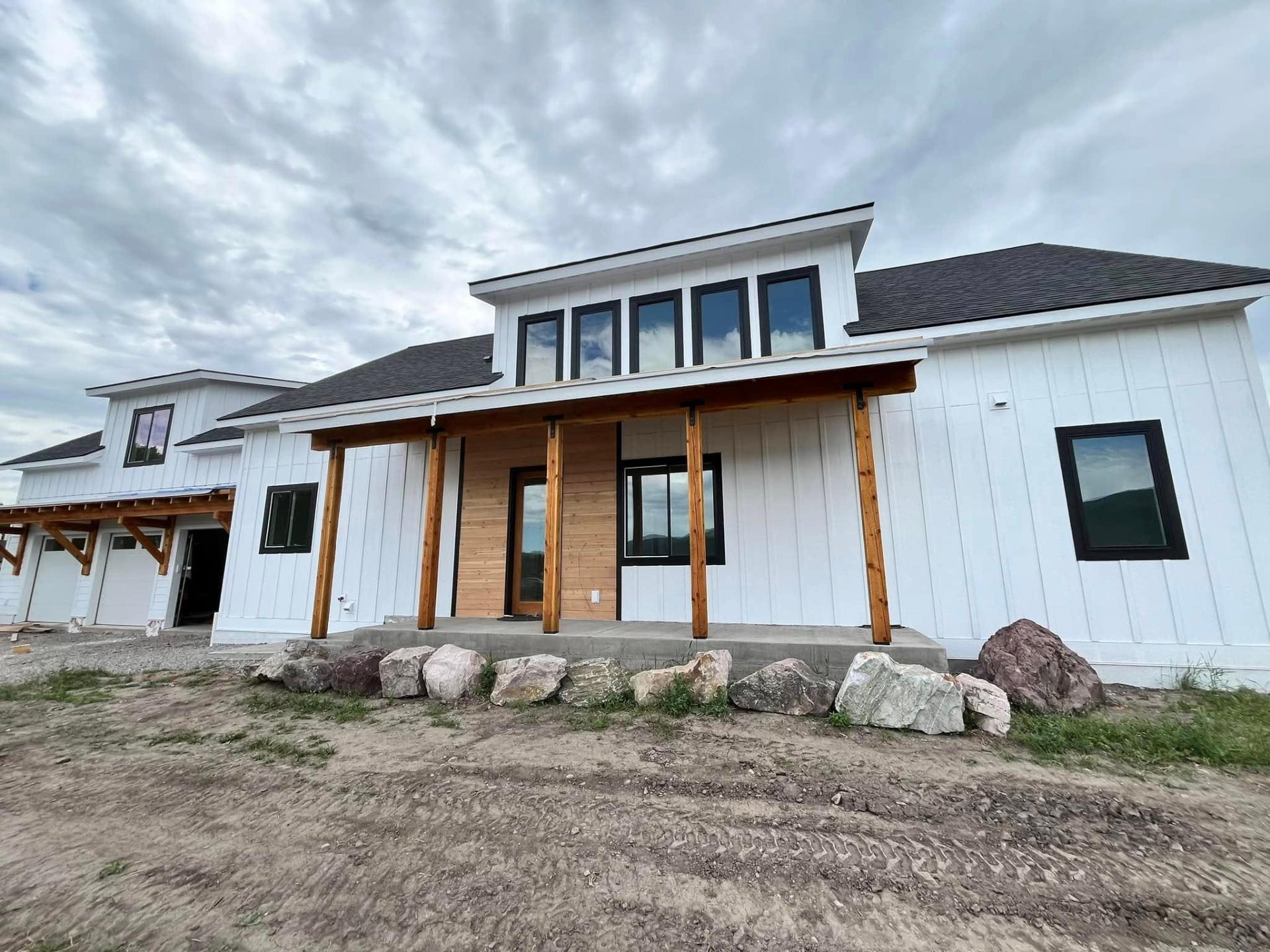 White modern farmhouse exterior painted by Treeline Painting in Missoula MT