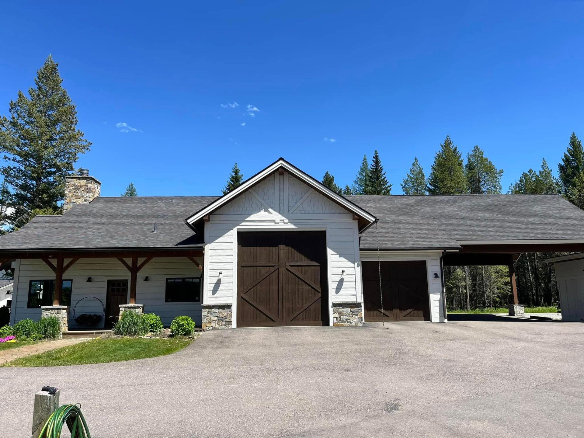 Mountain home garage exterior painting by Treeline Painting