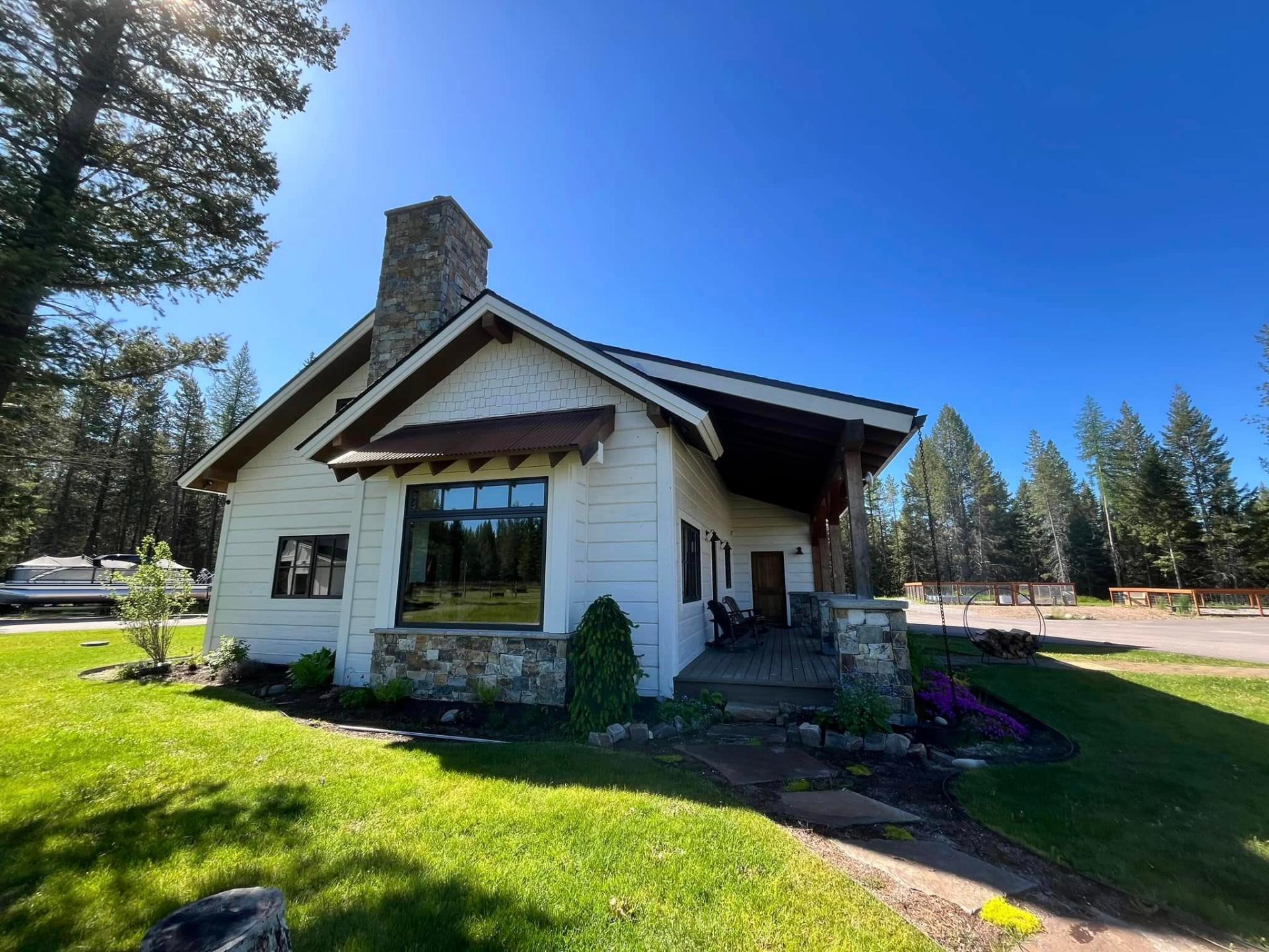 Craftsman cottage with crisp white exterior paint by Treeline Painting